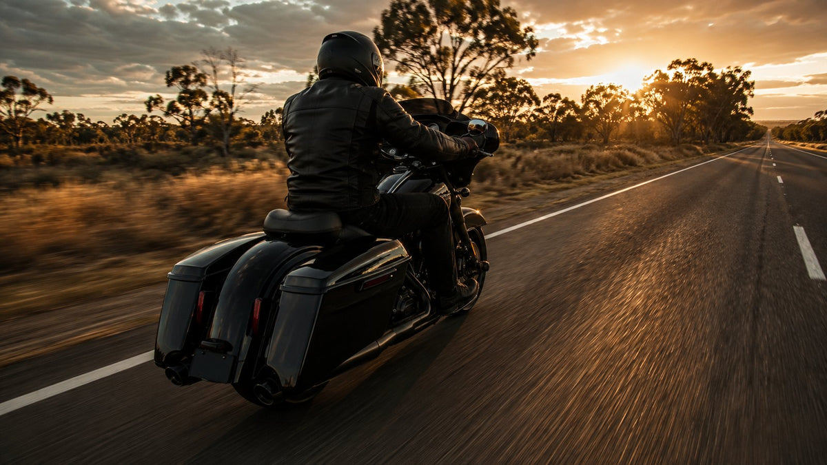Touring motorcycle at highway speed on an open Australian road at golden hour
